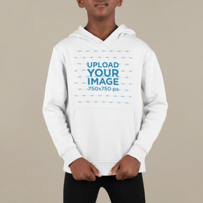 Hoodie Mockup of a Serious Boy Standing in a Studio