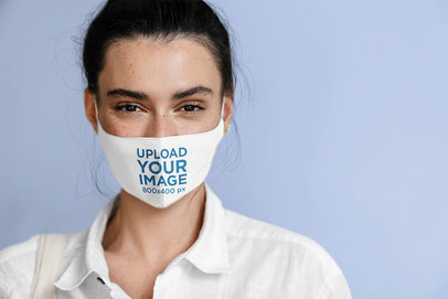 Face Mask Mockup Featuring a Happy Young Woman in a Studio 45664-r-el2