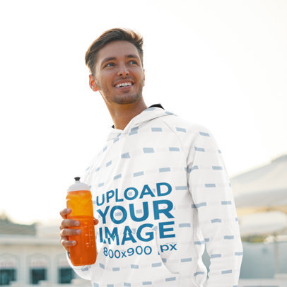 Pullover Hoodie Mockup Featuring a Man with an Energy Drink 