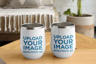 Mockup of Two Wine Tumblers Placed on a Small Table