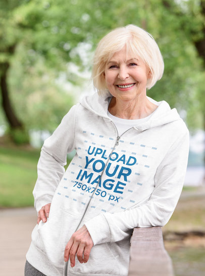 Full-Zip Hoodie Mockup Featuring a Happy Elderly Woman