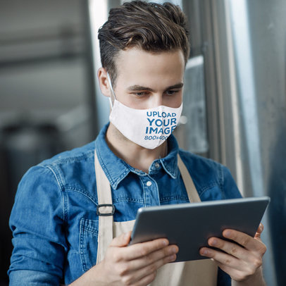 Face Mask Mockup of a Focused Man at a Brewery