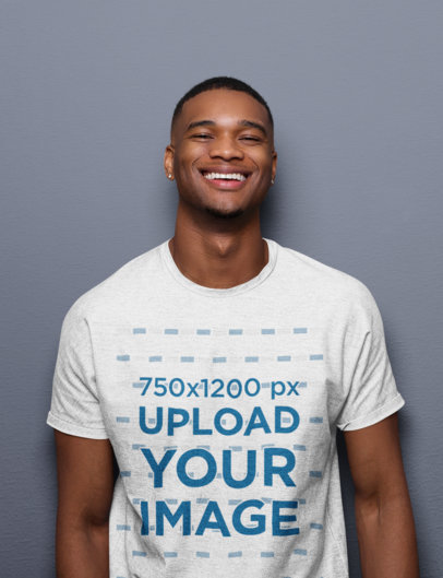 Mockup of a Smiling Man Wearing a Heathered Tee Against a Colored Background