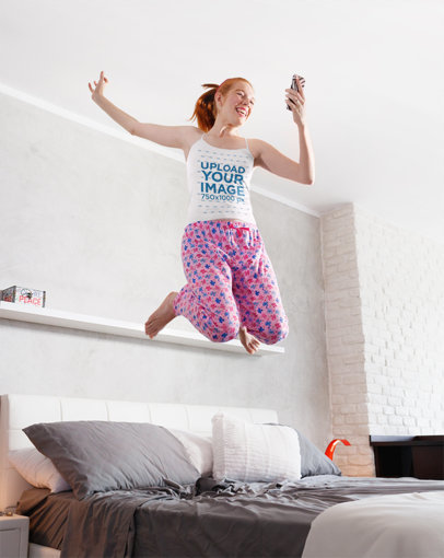 Camisole Tank Top Mockup of a Young Woman Jumping on Her Bed