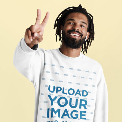 Sweatshirt Mockup of a Bearded Joyful Man Listening to Music at a Studio
