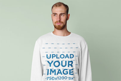 Sweatshirt Mockup Featuring a Serious Man with a Beard in a Studio