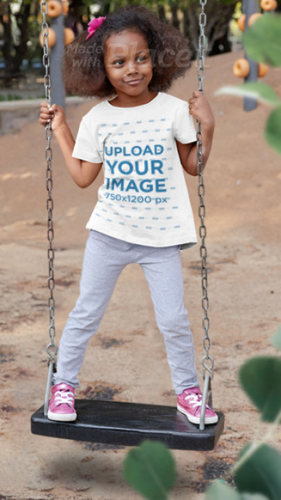 Parallax Video of a Playful Girl Wearing a T-Shirt on a Swing