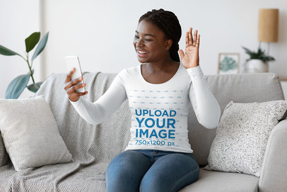 Long Sleeve Tee Mockup Featuring a Woman Making a Video Call at Home 