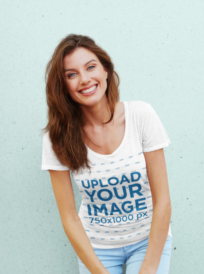 T-Shirt Mockup Featuring a Smiling Woman Against a Plain Background