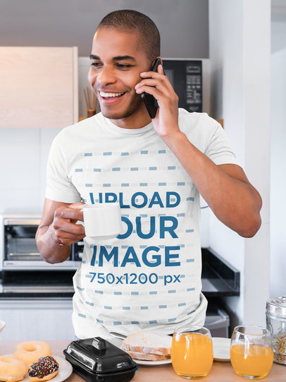 Basic T-Shirt Mockup of a Man Making a Call While Having Breakfast 