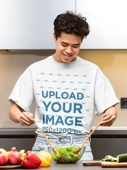 T-Shirt Mockup Featuring a Man Making a Salad
