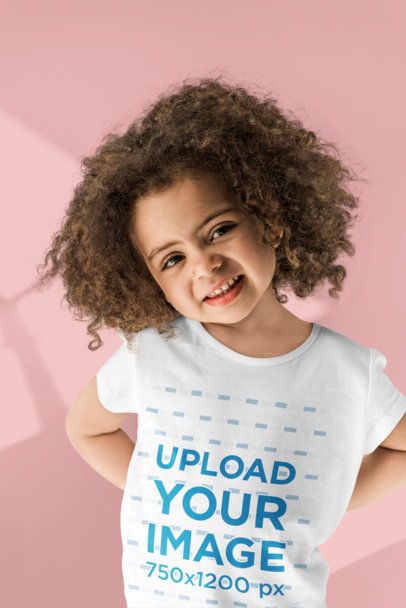 T-Shirt Mockup Featuring a Curly-Haired Girl Smiling 