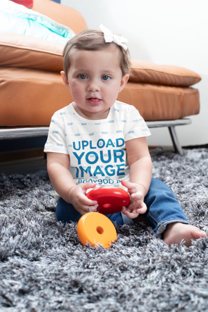 Sublimated T-Shirt Mockup of a Baby Girl Playing with Toys