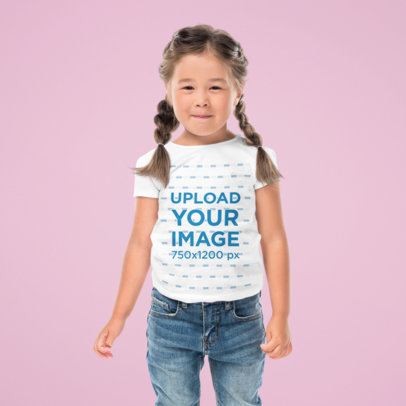 Tee Mockup of a Girl Standing Against a Solid Color Backdrop