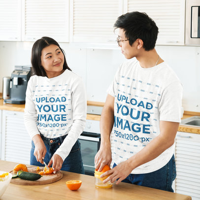 Tee Mockup of a Young Couple Preparing Natural Orange Juice