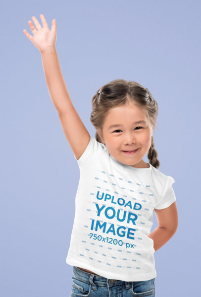 T-Shirt Mockup Featuring a Happy Girl Raising Her Hand