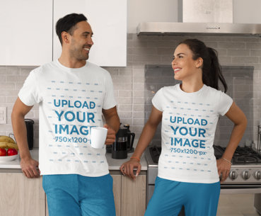 T-Shirt Mockup of a Man and Woman Having Coffee in the Kitchen