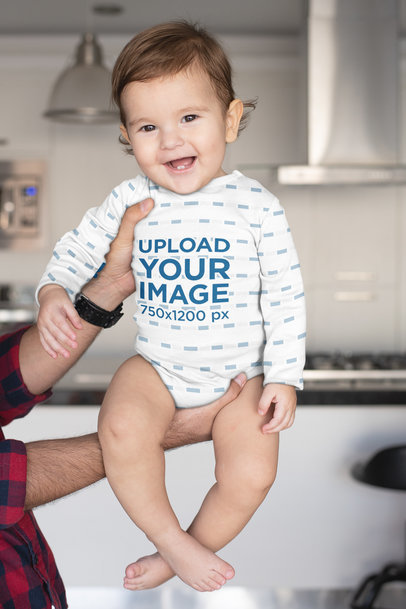 Sublimated Onesie Mockup of a Baby Being Held by His Dad