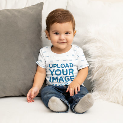 T-Shirt Mockup Featuring a Happy Baby Boy on a Couch 
