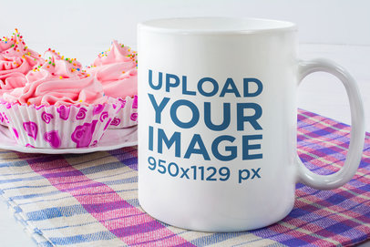 11 oz Coffee Mug Mockup Featuring Cupcakes with Pink Frosting