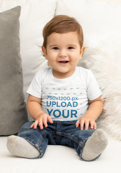 T-Shirt Mockup of a Smiling Baby on a Sofa