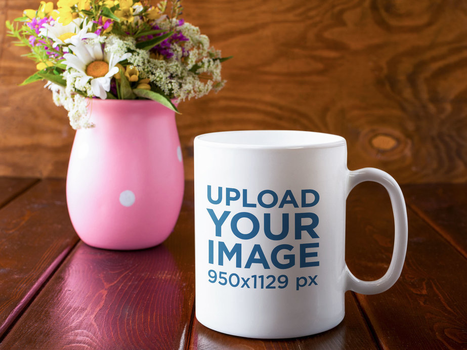 11 oz Coffee Mug Mockup Featuring a Flower Vase and a Wooden Table 