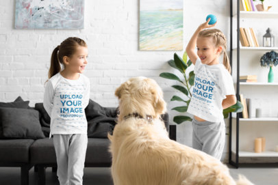 T-Shirt and Long Sleeve Tee Mockup of Two Little Girls Playing with Their Dog