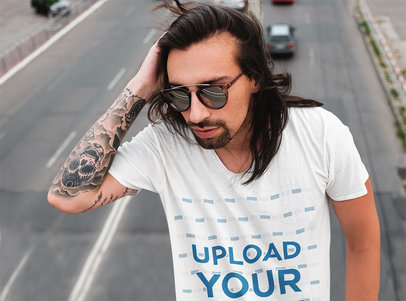 T-Shirt Mockup Featuring a Man with an Arm Tattoo on a Highway 43129-r-el2