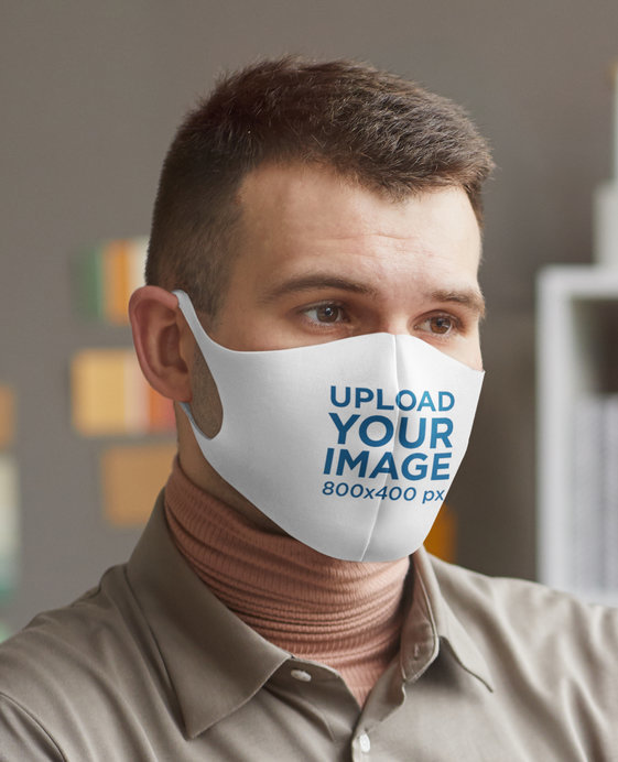 Closeup View Mockup of a Man with a Face Mask at Work