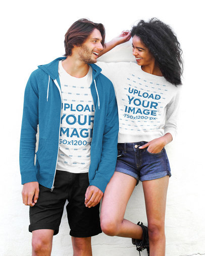 T-Shirt and Sweatshirt Mockup Featuring a Young Couple Laughing
