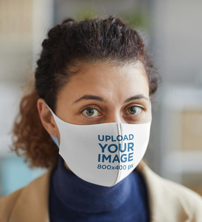 Face Mask Mockup Featuring a Serious Curly-Haired Woman 