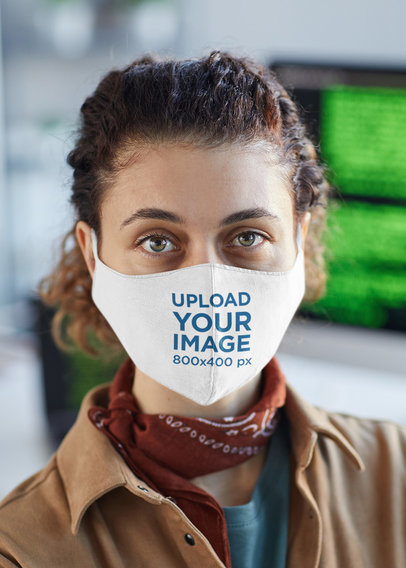 Face Mask Mockup of a Woman with a Computer in the Background
