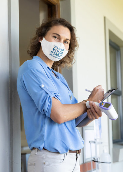 Face Mask Mockup of a Woman Holding an Infrared Thermometer 46035-r-el2