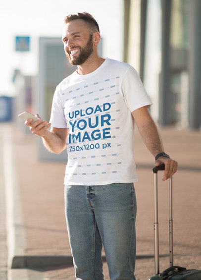 Tee Mockup of a Man with a Suitcase