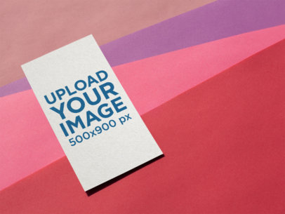 Vertical Business Card Mockup on a Multi-Colored Surface a14990