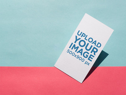 Business Card Lying on a Light Blue and Pink Surface a15011