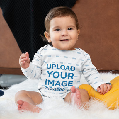 Mockup of a Baby Boy Wearing a Sublimated Long-Sleeve Onesie