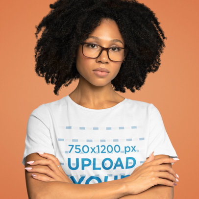 T-Shirt Mockup Featuring a Serious-Looking Woman with Crossed Arms