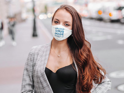 Mockup Featuring a Long-Haired Woman Wearing a Customizable Face Mask in the City 