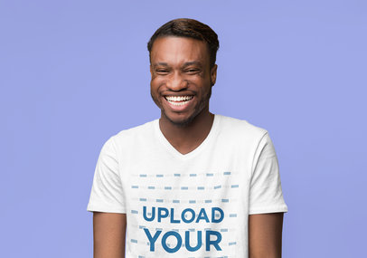 T-Shirt Mockup Featuring a Man Laughing in a Studio