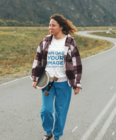 T-Shirt Mockup of a Woman on a Highway Doing Downhill Skateboarding