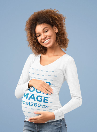Heathered Long Sleeve Tee Mockup Featuring a Pregnant Woman Posing at a Studio