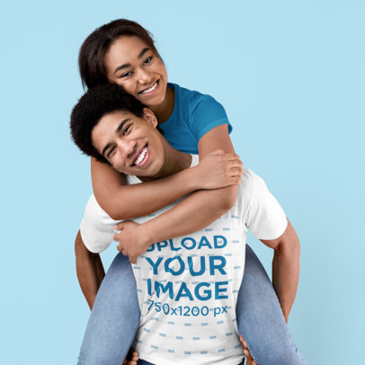 T-Shirt Mockup Featuring a Happy Young Man and His Girlfriend at a Studio