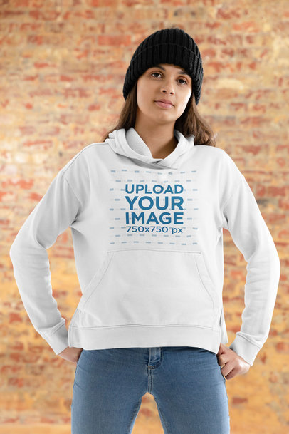 Hoodie Mockup Featuring a Woman and a Brick Wall in the Background