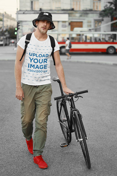 Basic Tee Mockup of a Man With a Bike 