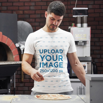 T-Shirt Mockup Featuring a Man Making Pizza 