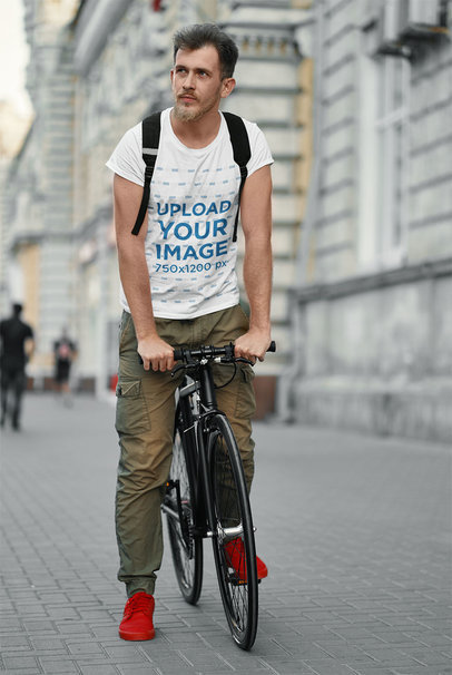 T-Shirt Mockup of a Man Riding His Bike in the City 