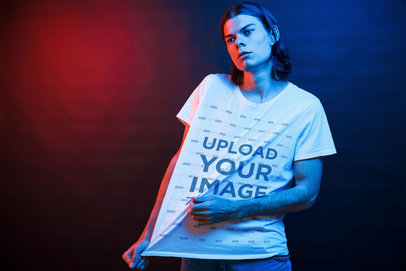 Mockup of Man Stretching His T-Shirt Under Colored Lights 46443-r-el2