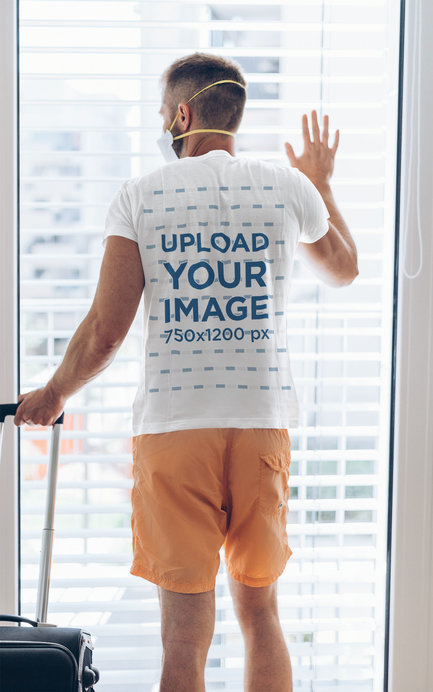 Back-View T-Shirt Mockup of a Man Traveling with a Suitcase