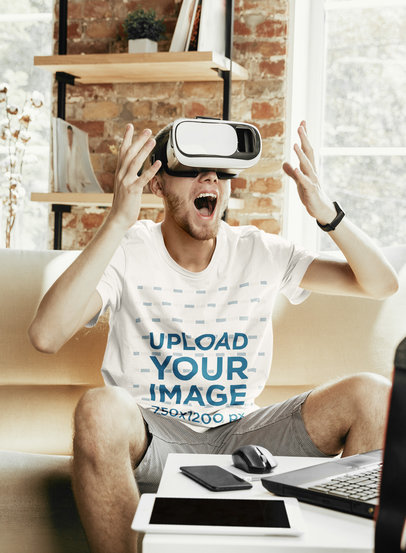 T-Shirt Mockup of a Man Playing with a VR Device at Home